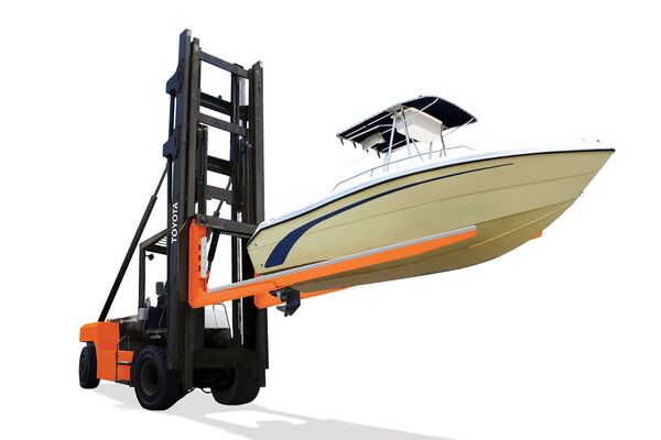 A Toyota marina forklift lifting a boat in the air