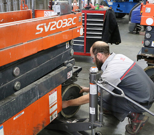 Technician_Changing_Scissor_Lift_Tire