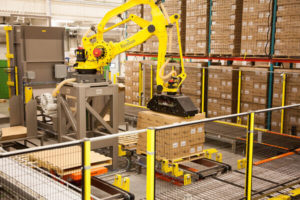 A Bastian robotic palletizer placing boxes on a pallet